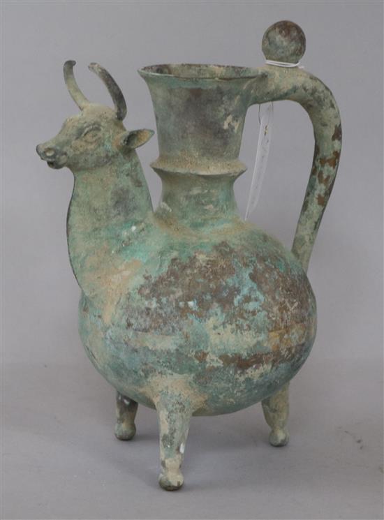 A Persian bronze tripod ewer